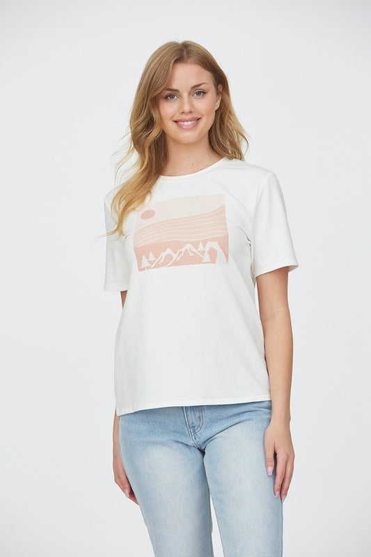 Woman wearing a mountain top with trees