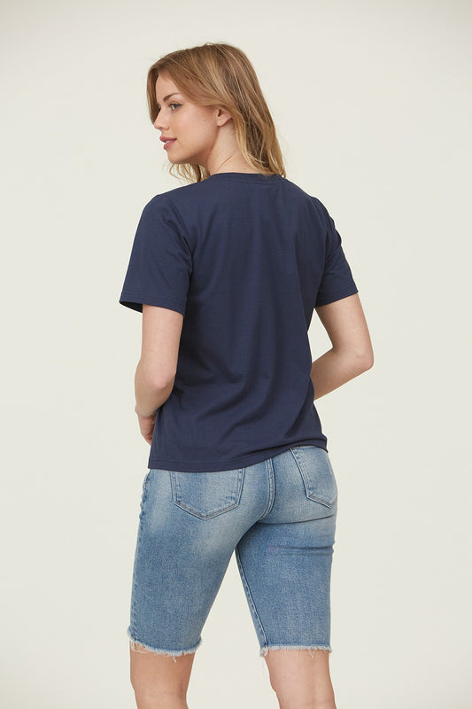 Woman wearing Navy Blue floral embroidered top