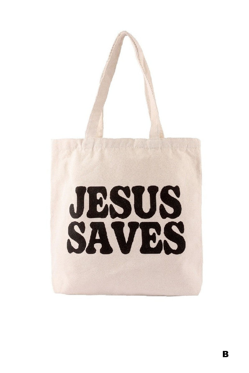 Beige tote bag with 'Jesus Saves' text on a white background