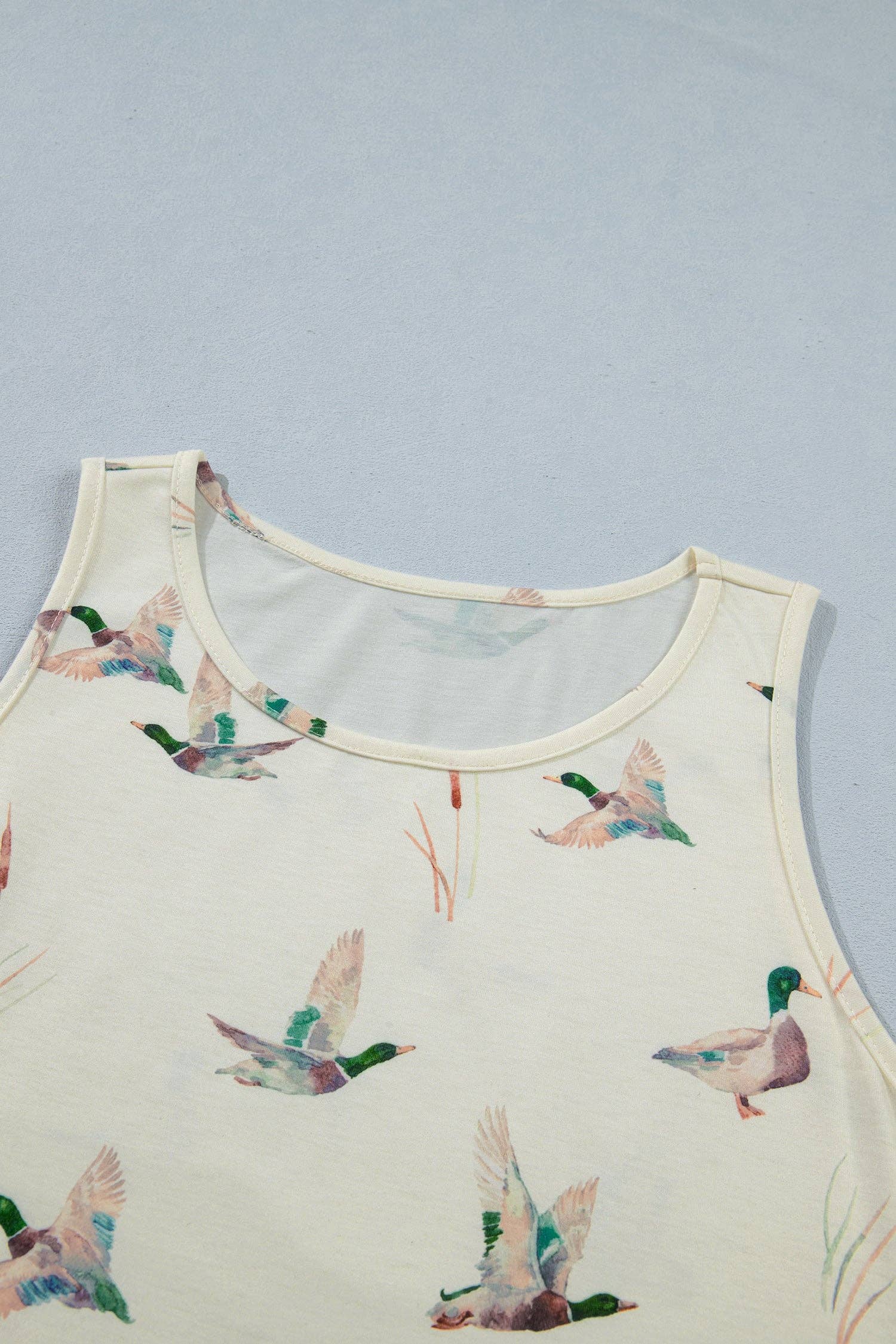Vest with duck pattern on a light blue background